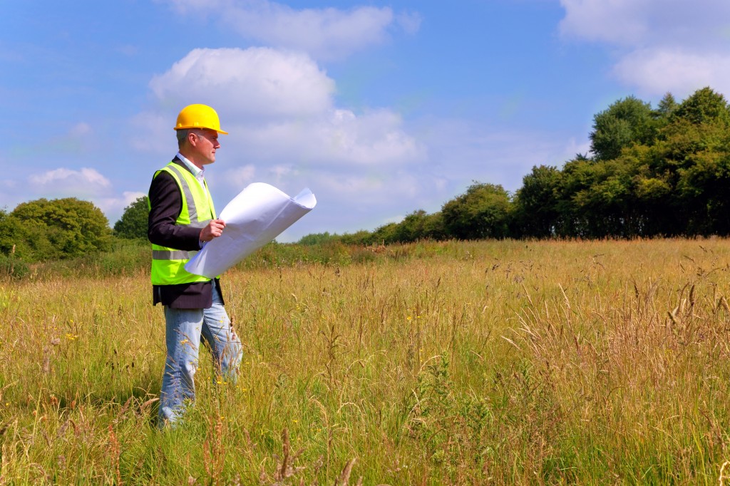 Architect surveying a new building plot